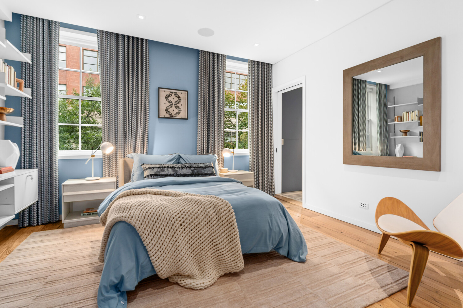 430 Hudson Street Manhattan, NY 10014 - Photo 10 of 35 a bedroom with a bed and wooden floor