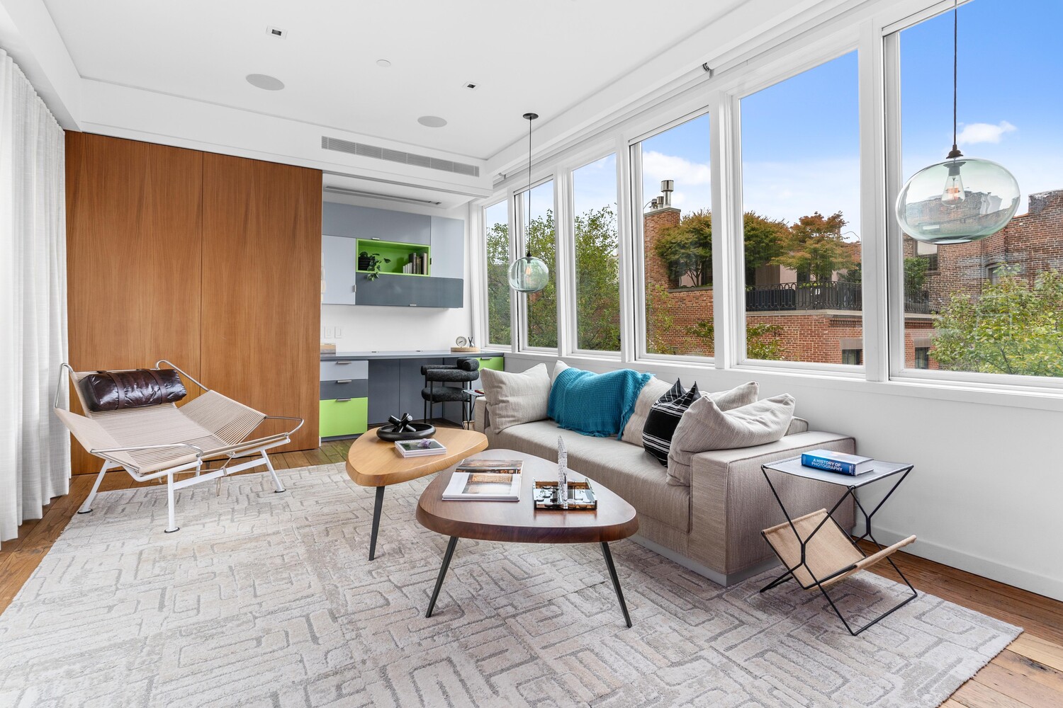 430 Hudson Street Manhattan, NY 10014 - Photo 14 of 35 a living room with furniture and a large window