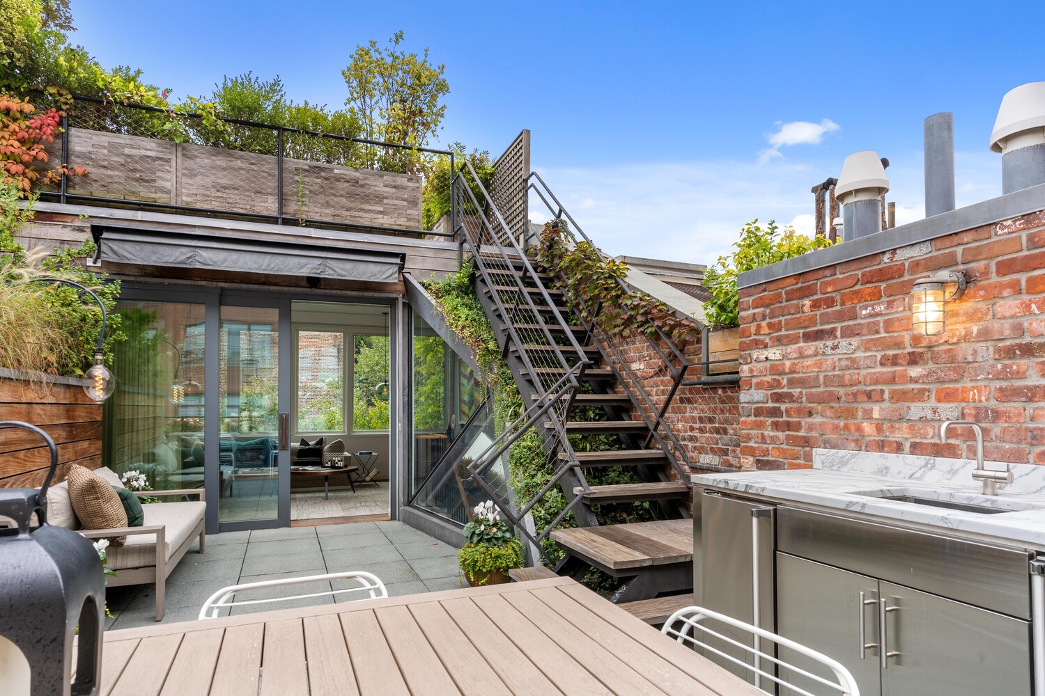 430 Hudson Street Manhattan, NY 10014 - Photo 18 of 35 a view of roof deck with patio
