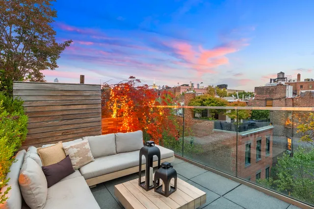 a view of a terrace with sitting area