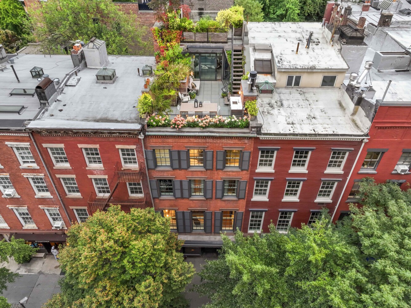 430 Hudson Street Manhattan, NY 10014 - Photo 26 of 35 aerial view of a brick building next to a yard