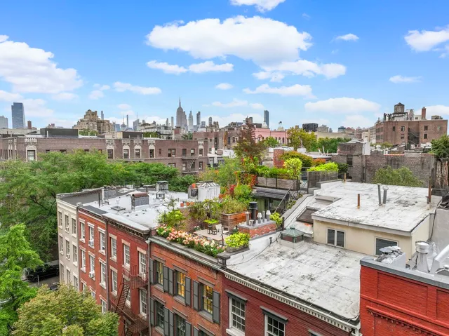 a view of a city with tall buildings