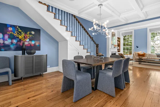a living room with furniture fireplace and window