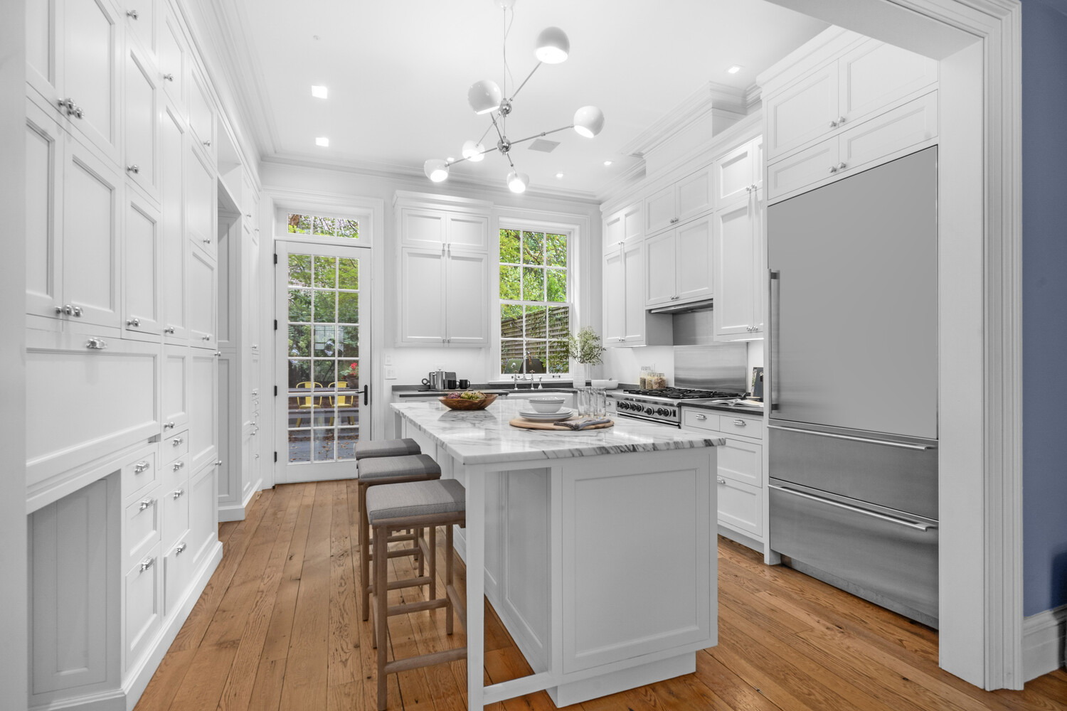 430 Hudson Street Manhattan, NY 10014 - Photo 3 of 35 a kitchen with cabinets a sink and appliances