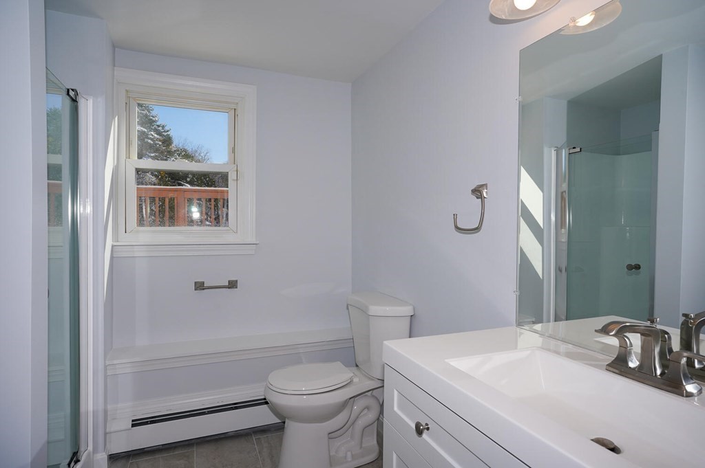 3 Rickey Drive Maynard, MA 01754 - Photo 16 of 25 a bathroom with a sink toilet vanity and tub