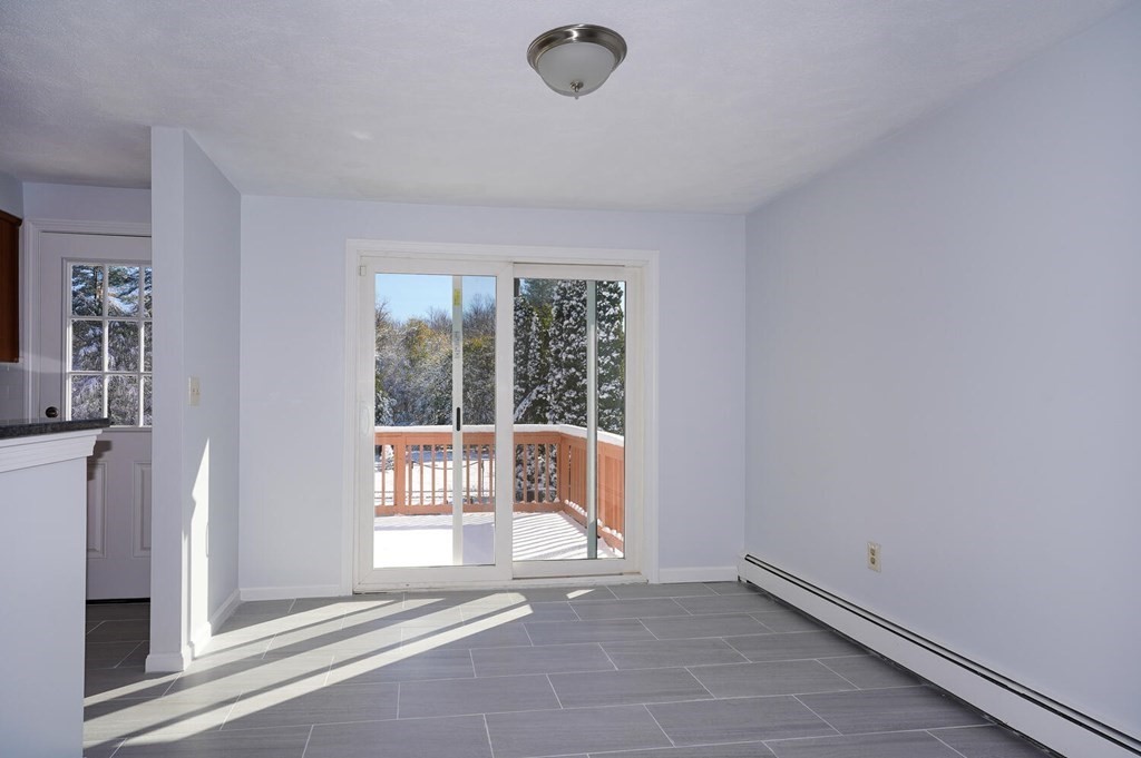3 Rickey Drive Maynard, MA 01754 - Photo 4 of 25 a view of an empty room with a window