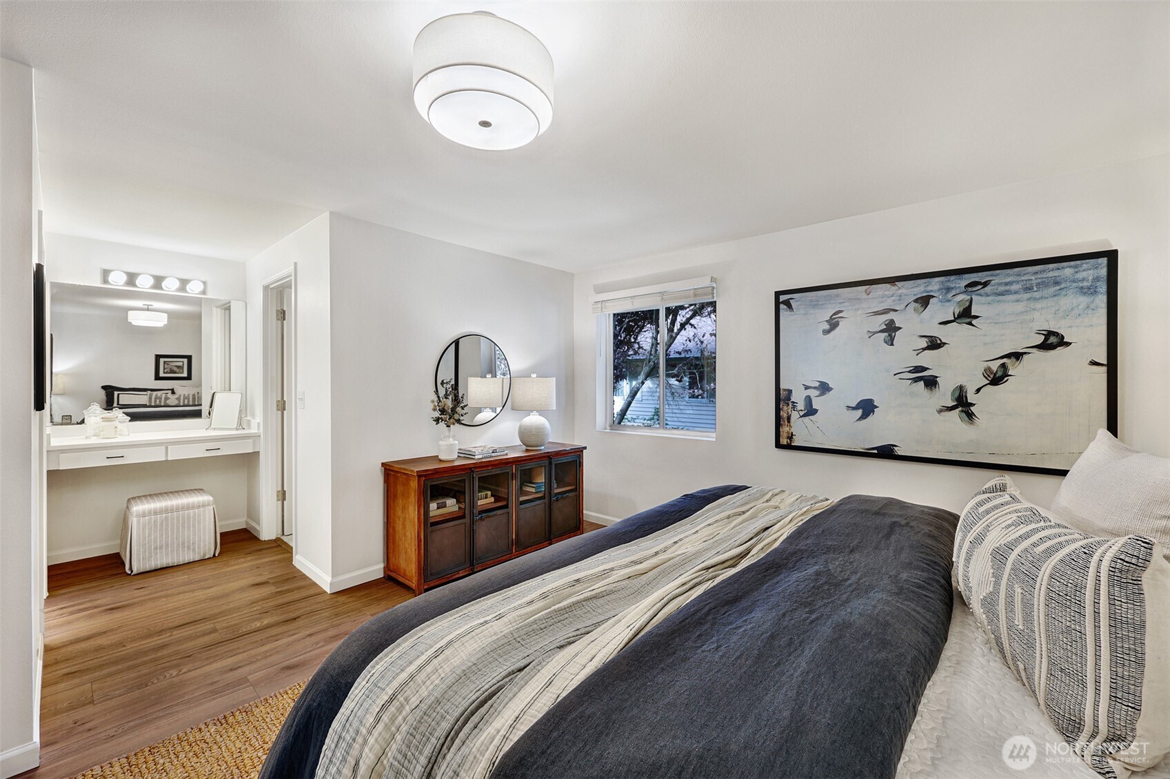 8828 238th Street Southwest, Unit B4 Edmonds, WA 98026 - Photo 21 of 37 a spacious bedroom with a bed and wooden floor