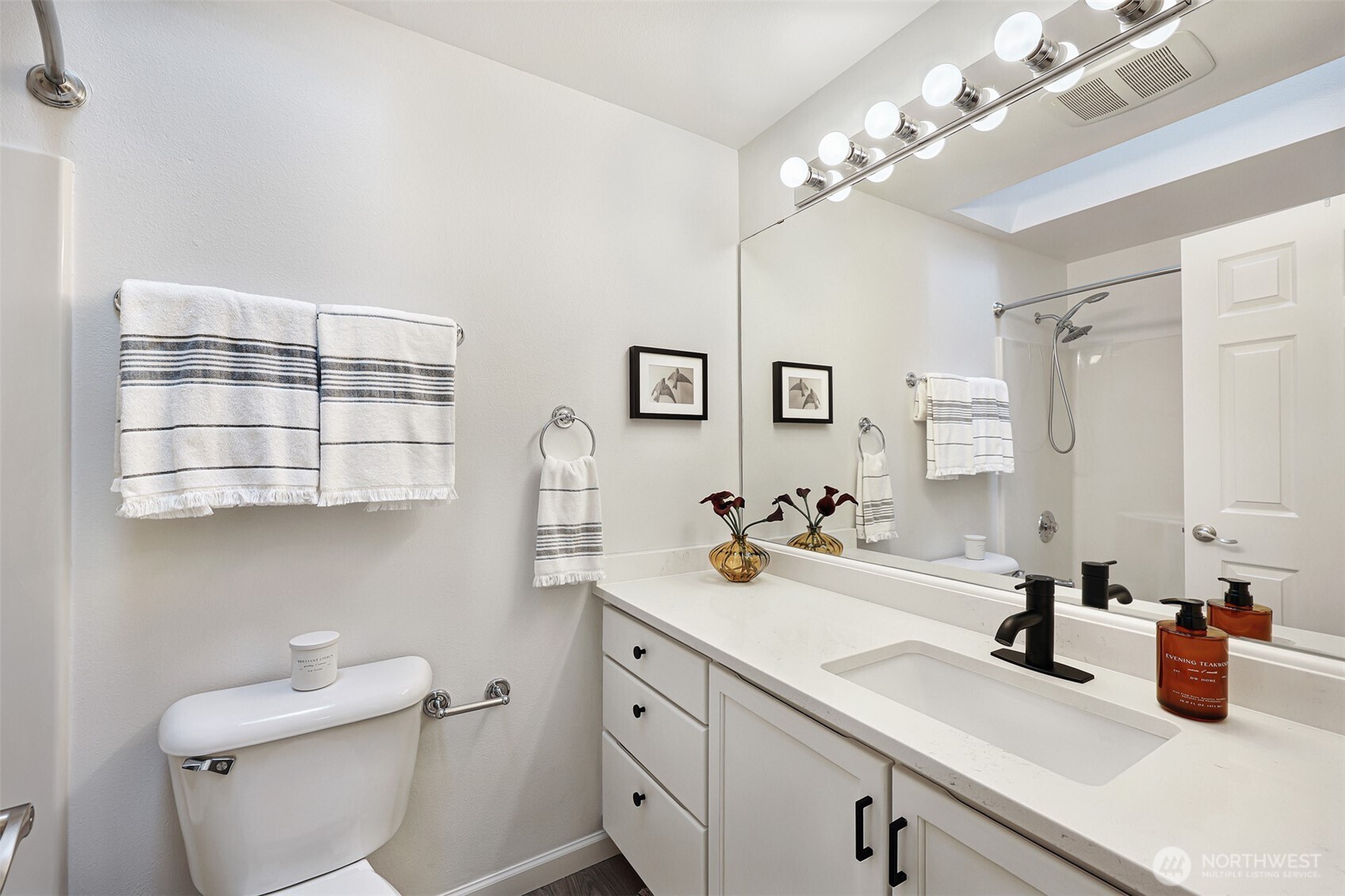 8828 238th Street Southwest, Unit B4 Edmonds, WA 98026 - Photo 24 of 37 a bathroom with a sink a toilet and a mirror