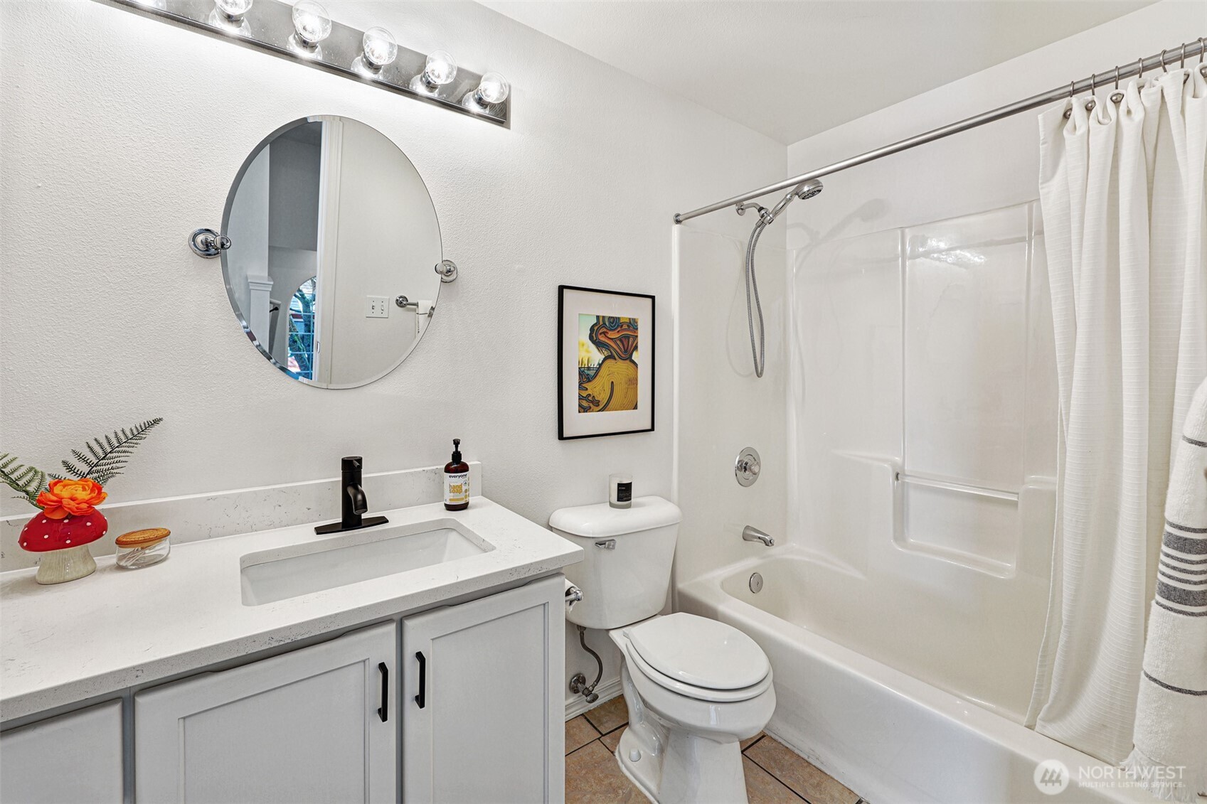 8828 238th Street Southwest, Unit B4 Edmonds, WA 98026 - Photo 26 of 37 a bathroom with a sink mirror toilet and shower