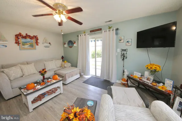 a bedroom with furniture and a flat screen tv