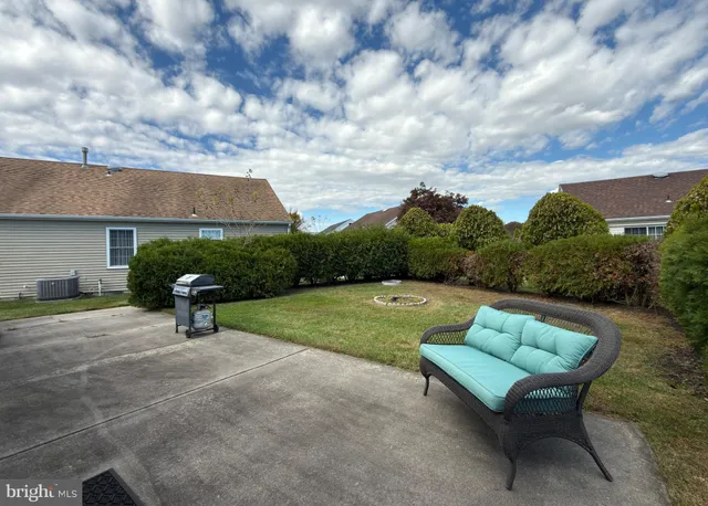 a view of backyard with seating space