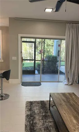 a living room with a couch and large window