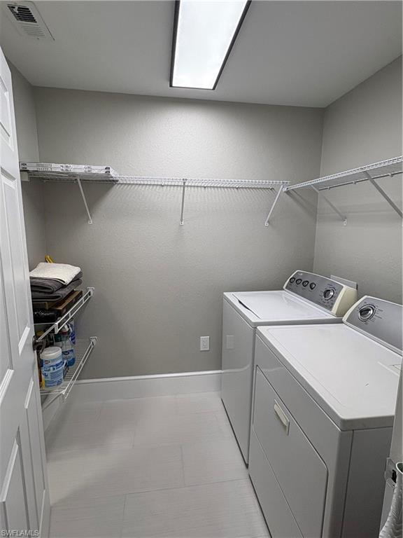 7940 Preserve Circle, Unit 914 Naples, FL 34119 - Photo 4 of 16 a utility room with dryer and washer