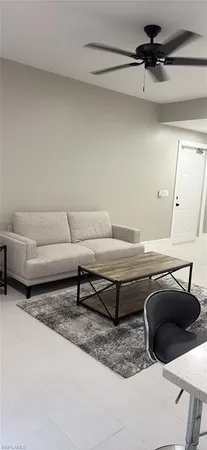 a living room with furniture and a rug