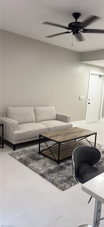 7940 Preserve Circle, Unit 914 Naples, FL 34119 - Photo 10 of 16 a living room with furniture and a rug