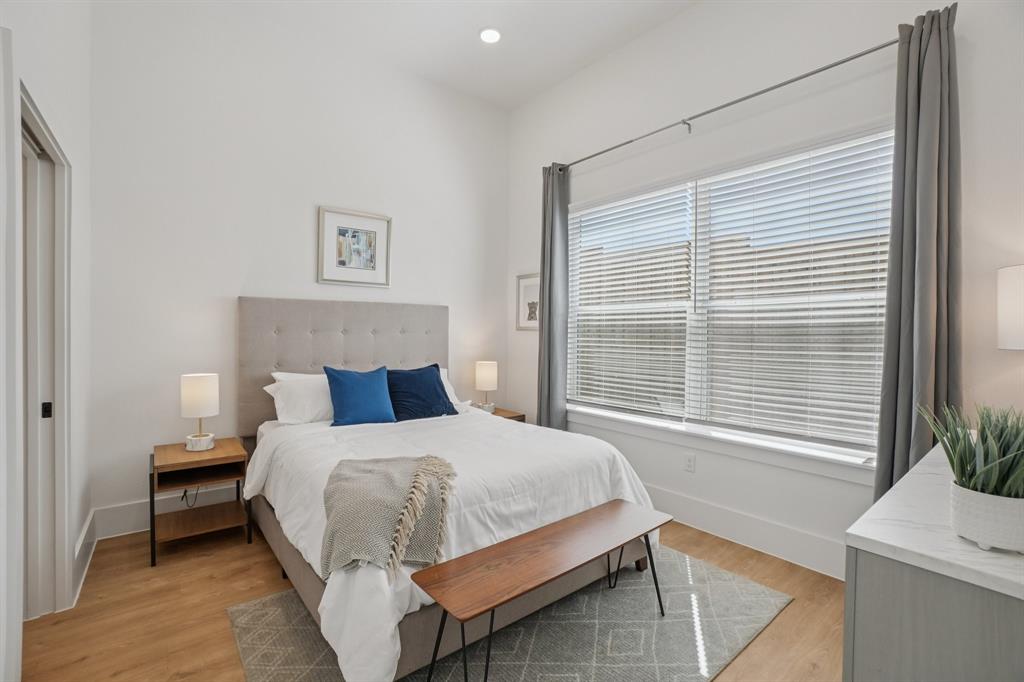 6418 Maple Avenue, Unit 312 Dallas, TX 75235 - Photo 9 of 16 a bedroom with a bed and a window