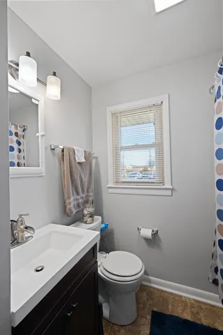 a bathroom with a sink and a toilet