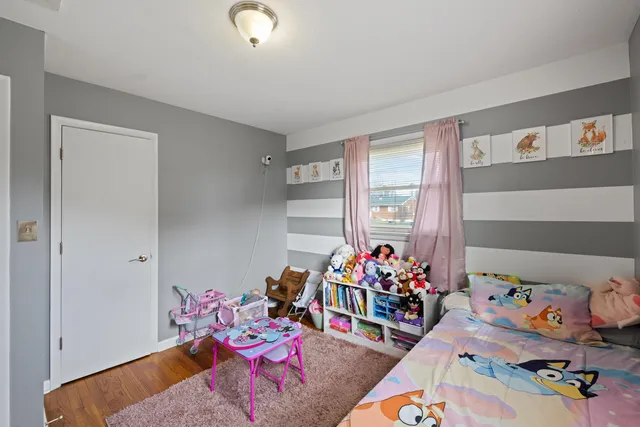 a view of a storage room with wooden floor