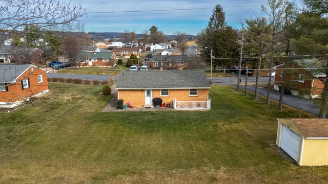 an aerial view of a house with outdoor space