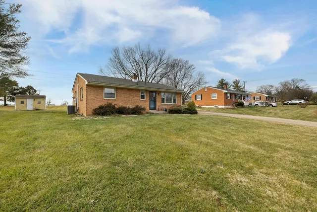 a view of house with garden