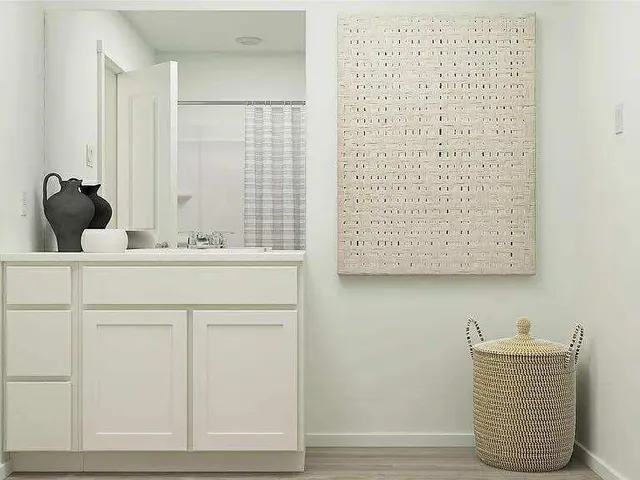 a bathroom with a toilet and a shower curtain