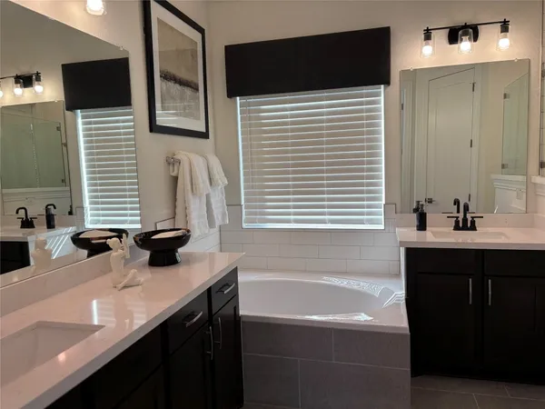 a kitchen with a table chairs and a refrigerator