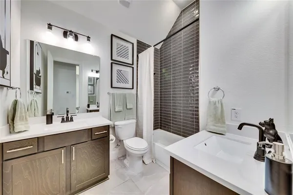 a bathroom with a sink a mirror and shower