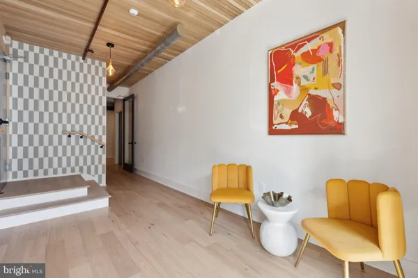a living room with furniture and a chair