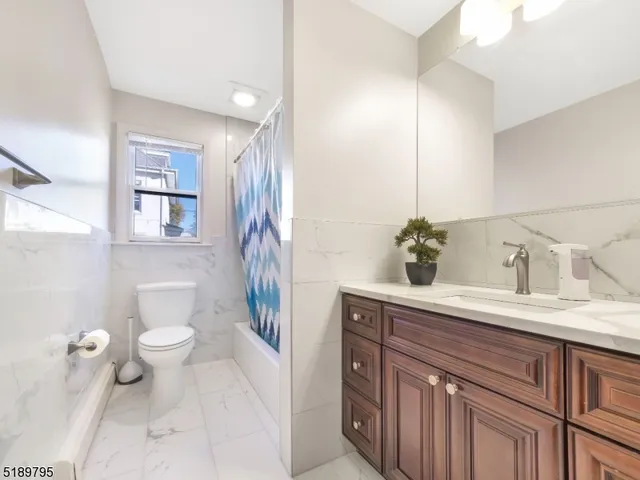 a bedroom with a bed and a lamp on table