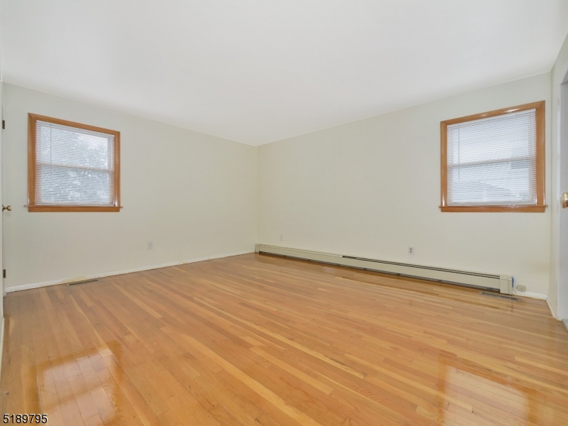 69 Rector Street Millburn, NJ 07041 - Photo 15 of 29 a view of an empty room with a window