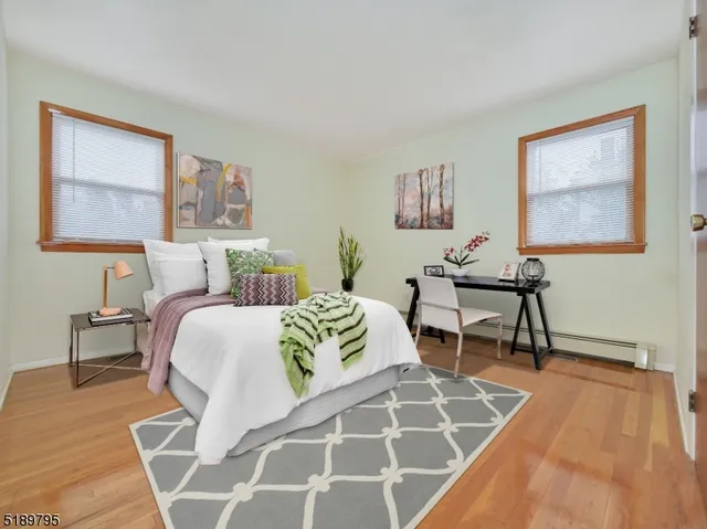 a bedroom with a bed a table and chair