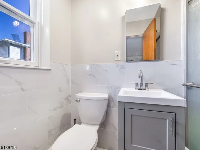 a view of a patio with a table and chairs under an umbrella