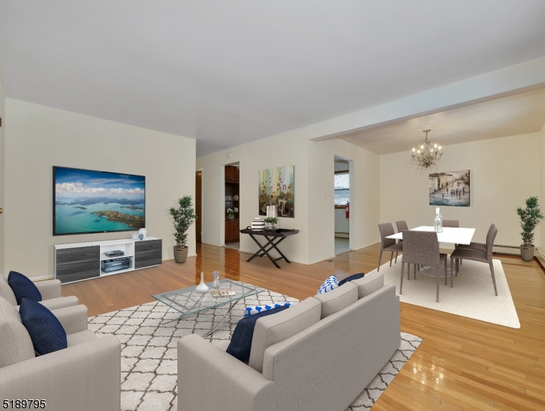 69 Rector Street Millburn, NJ 07041 - Photo 4 of 29 a living room with furniture and a flat screen tv