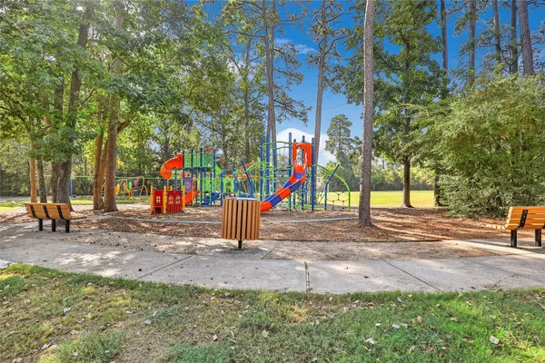 a childrens park with lots of swings and slides