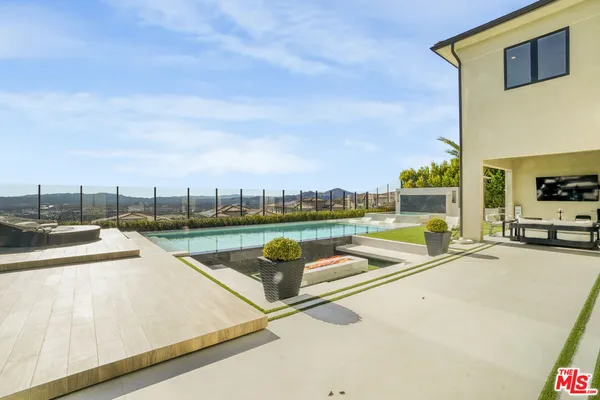 a view of a patio with swimming pool