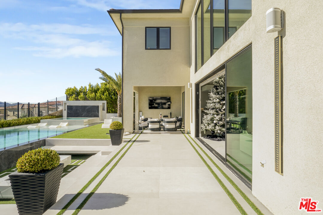 20306 Willoughby Lane Porter Ranch, CA 91326 - Photo 19 of 40 a view of swimming pool with seating space