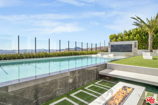 a swimming pool view with a outdoor space