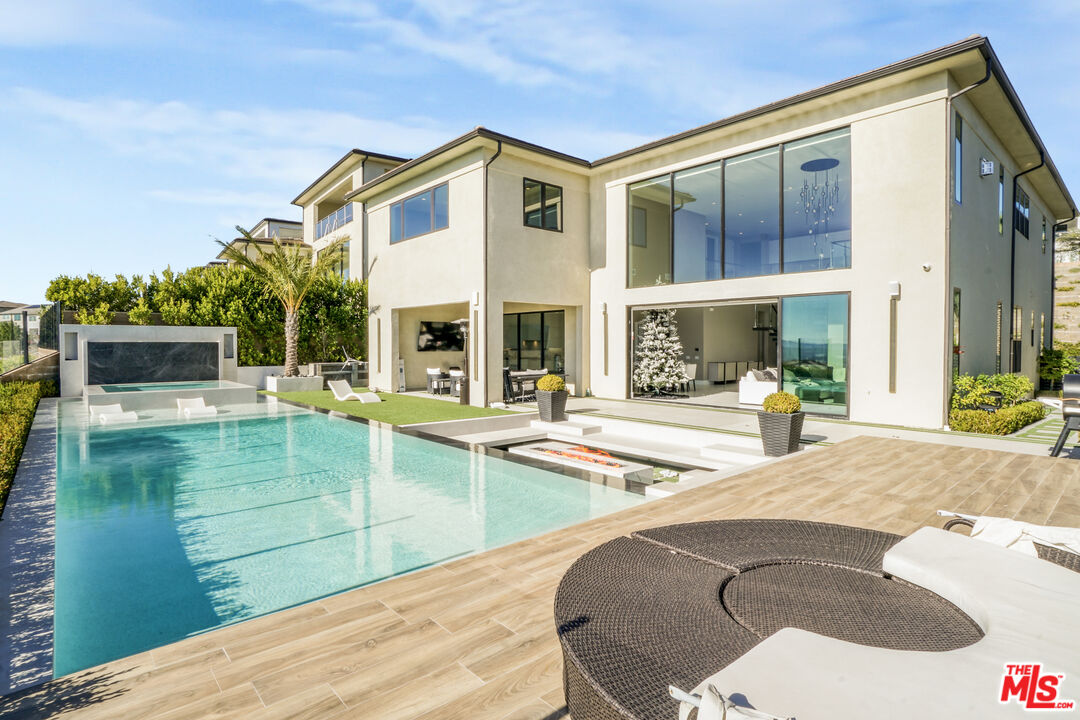 20306 Willoughby Lane Porter Ranch, CA 91326 - Photo 24 of 40 a view of a house with a swimming pool