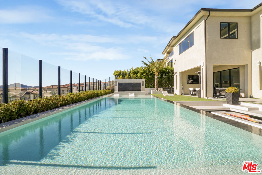 20306 Willoughby Lane Porter Ranch, CA 91326 - Photo 25 of 40 a view of a house with a yard