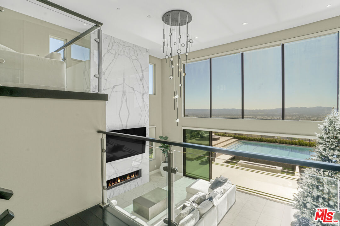 20306 Willoughby Lane Porter Ranch, CA 91326 - Photo 26 of 40 a kitchen with a sink and chandelier