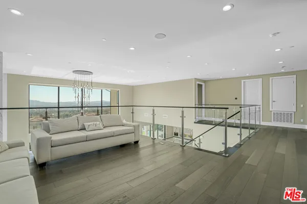 a spacious bedroom with a large bed and a couch