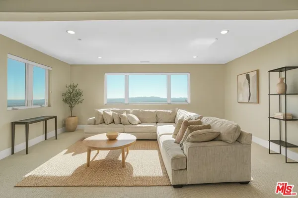 a spacious bathroom with a tub sink shower and mirror