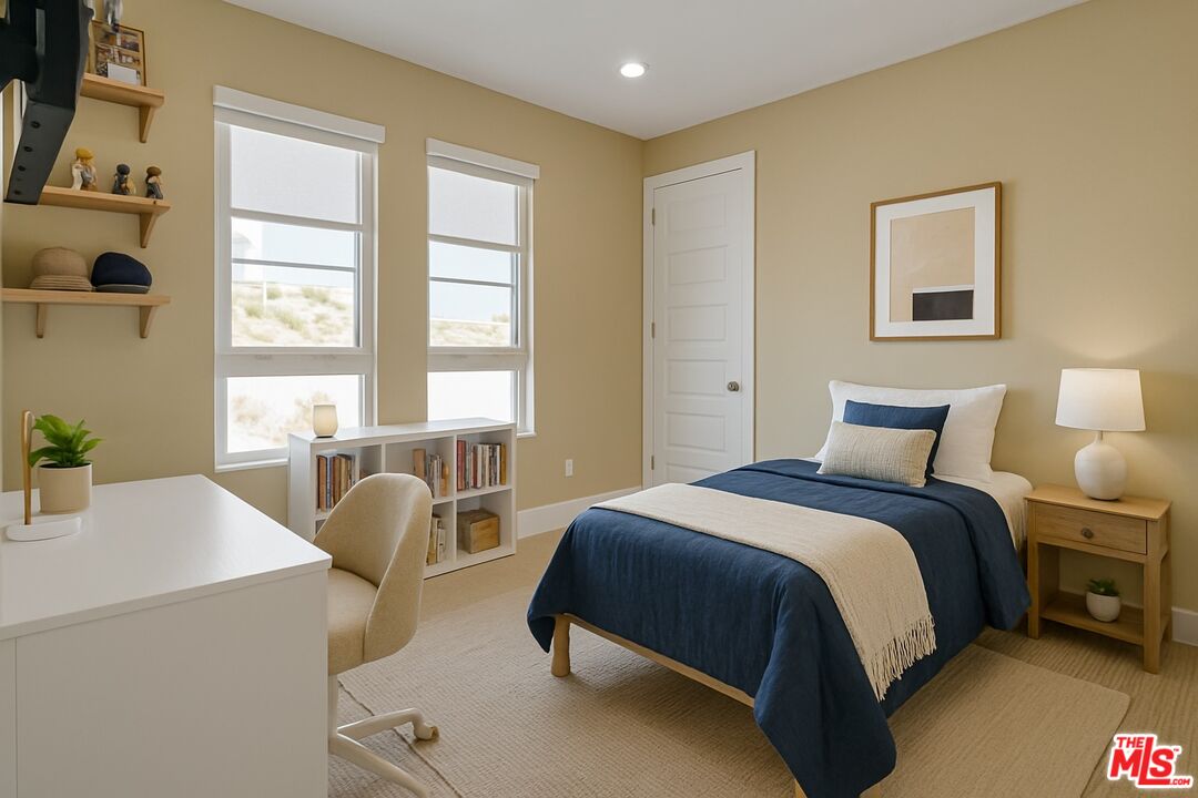 20306 Willoughby Lane Porter Ranch, CA 91326 - Photo 33 of 40 a spacious bedroom with a bed and a table