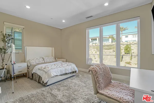 an aerial view of residential houses and street