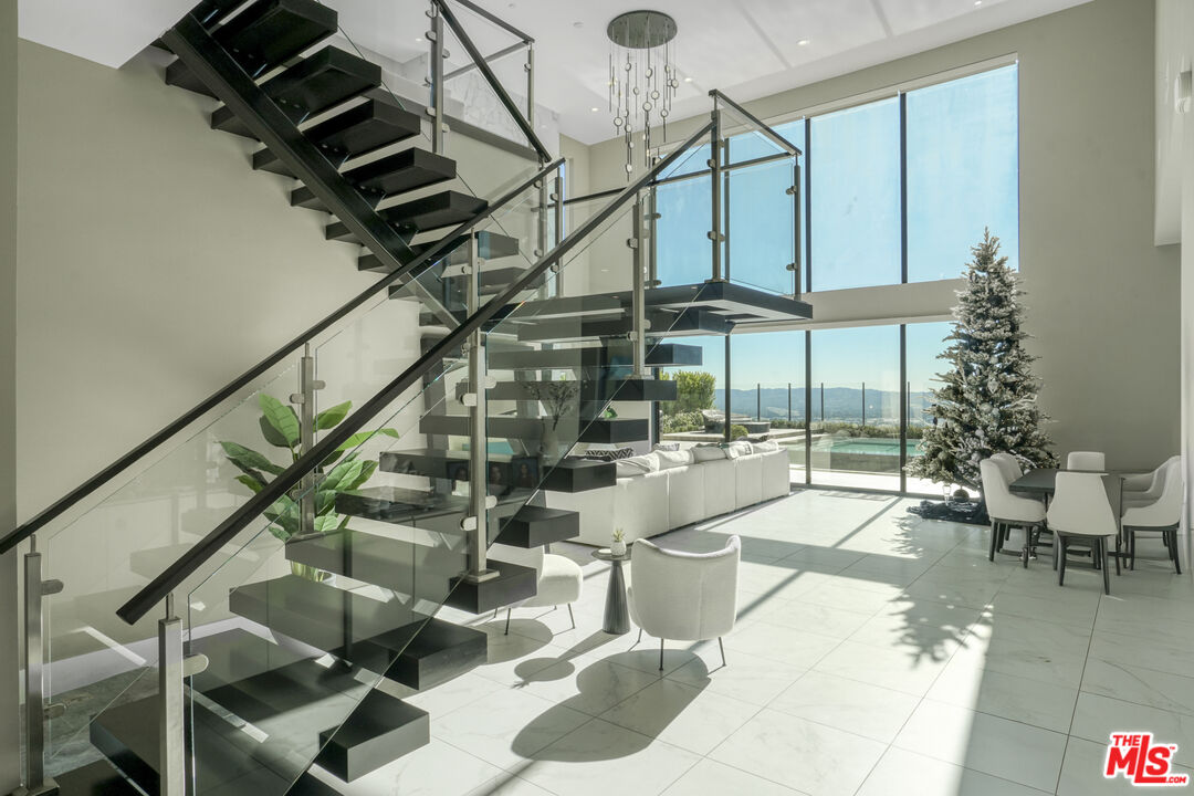 20306 Willoughby Lane Porter Ranch, CA 91326 - Photo 5 of 40 a view of entryway and hall with wooden floor