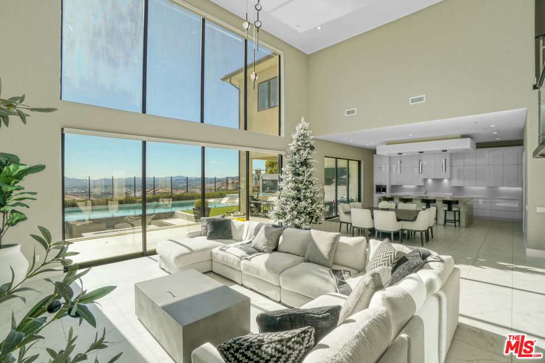 20306 Willoughby Lane Porter Ranch, CA 91326 - Photo 8 of 40 a living room with furniture and a large window