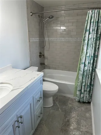 a bathroom with a sink a toilet and a bathtub