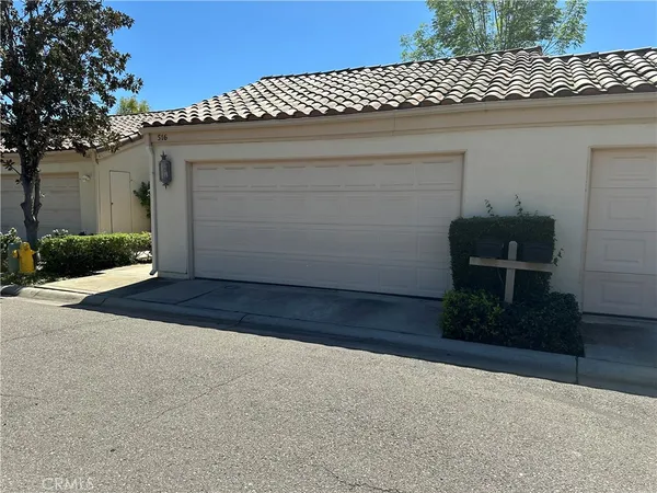 a view of backyard and a garage