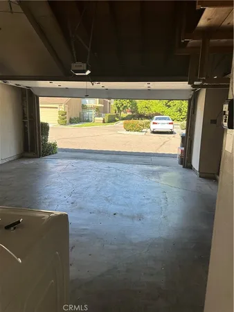 a view of room with wooden floor