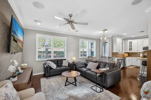 a view of entryway and hall with wooden floor